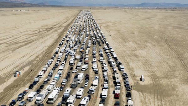 US festival revelers begin exodus after flooding strands thousands in the desert