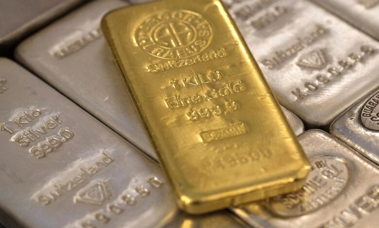 Gold edges down as rising bond yields dent appeal