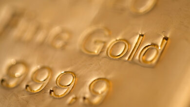 Gold edges higher; hovers near one-week low on tempered Middle East fears