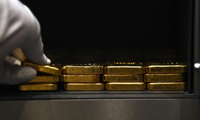 Gold prices hit record highs on safe-haven demand