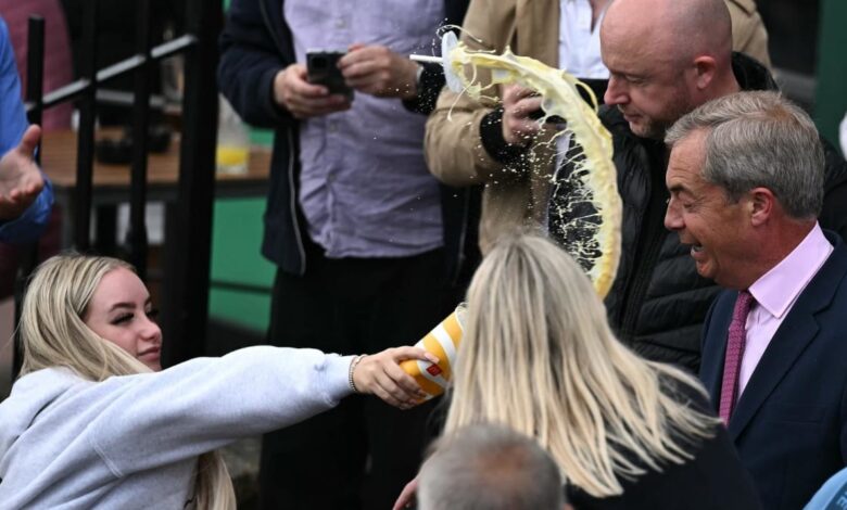 UK right-winger Nigel Farage doused with drink at election campaign launch