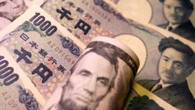 Dollar near one-week high on jobs relief; yen sags