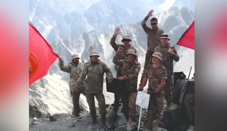 Internal Troops servicemen install flag on Mount Adygine in honor of 100th anniversary of Kyrgyz police