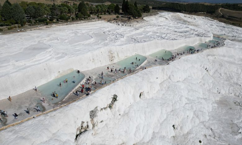 1.7M tourists visit Türkiye's thermal springs Pamukkale in 8 months