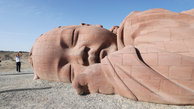 Giant baby sculpture draws visitors to desert