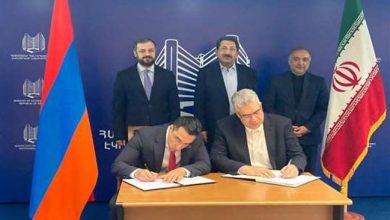 Iran and Armenia have signed a barter trade deal after opening a large Iranian trade center in the Armenian capital Yerevan.