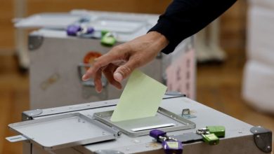 Japan's ruling coalition set to lose parliamentary majority, exit polls show