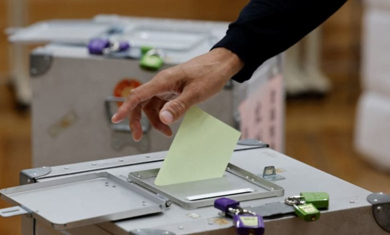 Japan's ruling coalition set to lose parliamentary majority, exit polls show